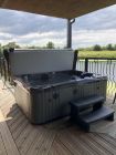 Private hot tub on decked area ovelooking the river